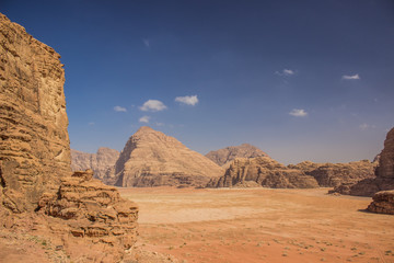 Wadi Rum Jordan Middle East desert scenery top view sand valley surrounded by dry rocky mountains picturesque landscape from above, copy space
