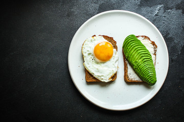 avocado sandwich, healthy food (bread toast snack) menu concept. food background. top view. copy space