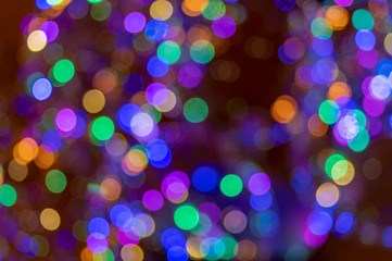 Holiday Lights bubbles Bokeh background. Abstract glitter lights multicolored, de-focused. Banner celebration Bokeh glowing design
