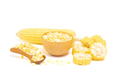Sweet corn and seeds in wooden bowl with brown wooden spoon isolated on white background