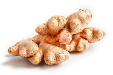 Fresh ginger root on a white background, isolate close-up.