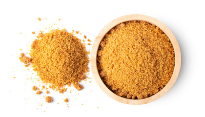 Brown cane sugar in wood bowl isolated on white background