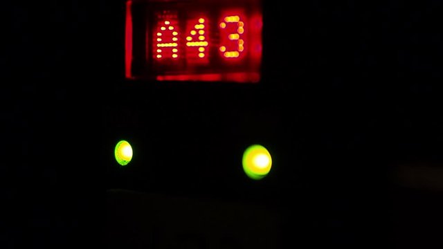 LCD screen on a DMX controller showing A43 and blinking lights indicating data passing through.