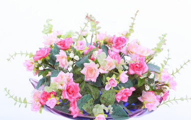Bouquet rose in glass vase isolated on white background 