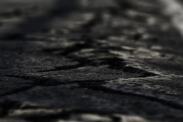 asphalt in cracks texture / abstract background cracks on asphalt road