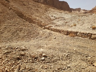 Ruins of the ancient Masada, a mountaintop fortress, near the Dead Sea in Israel. It was built by...