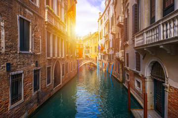 Fototapeta na wymiar Canal with gondolas in Venice, Italy. Architecture and landmarks of Venice. Venice postcard with Venice gondolas.