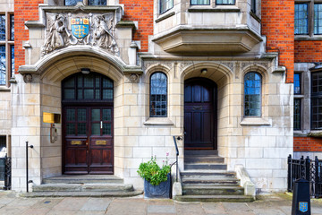 Typical street scene in the central London district with familiar architecture facades to urban housing.