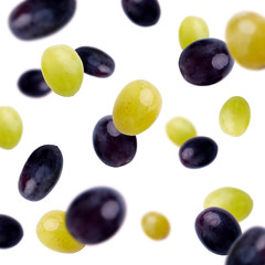 Black and green olives flying over white background