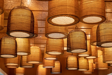 weaving bamboo lantern. handmade hanging lamp background and texture in night time. asian...