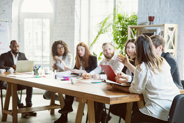 Best team. Group of young business professionals having a meeting. Diverse group of coworkers...