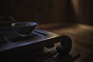 Obraz na płótnie Canvas Chinese tea ceremony, tea table, cup / teapot on the table, oriental traditions