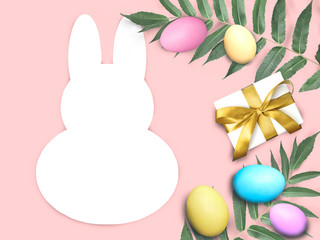 Happy Easter mock card with bunny rabbit frame, multicolor eggs, palm leaves and gift box on pink background. Greeting holiday concept with copyspace.