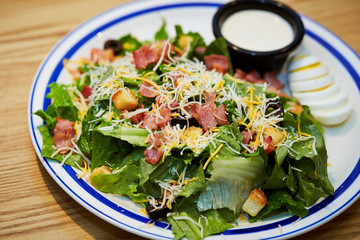 Bacon and cheese salad on plate