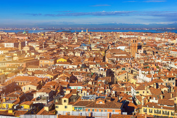 Fototapeta premium Venice panoramic aerial view with red roofs, Veneto, Italy. Aerial view of the Venice city, Italy. Venice is a popular tourist destination of Europe. Venice, Italy.