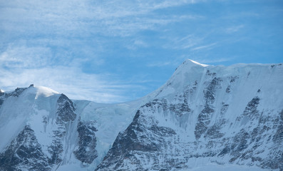 View from the top of the Schiltorn mountain in the Alps, Switzerland. Photographed in on a cold clear day in January.