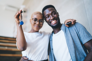 Happy black couple receiving house key