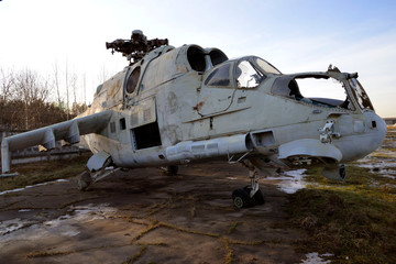 Fototapeta na wymiar old broken military helicopter without blades and glasses