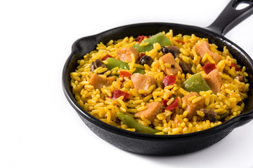 Fried rice with chicken and vegetables on frying iron pan isolated on white background
