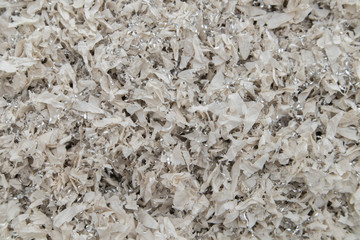 Plastic scraps and small metals background on the floor are environmental problems.