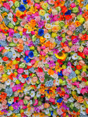 Fototapeta na wymiar Wall of flowers in a flower shop