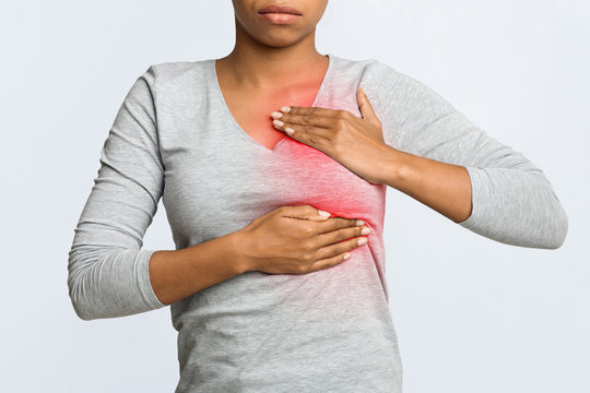 Close up of young woman pulping her breast