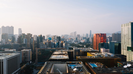 Fototapeta na wymiar Aerial scenery panoramic view from drone of Hong Kong skyscrapers skyline metropolitan landscape. Modern concrete cityscape of urban downtown with business and financial buildings. City infrastructure