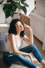 Obraz premium Portrait of beautiful young brunette woman with makeup