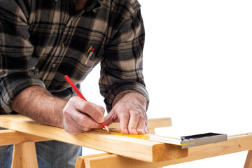 Fototapeta na wymiar Close-up. Carpenter with pencil and carpenter's square draw the cutting line on a wooden board. Construction industry. White background.