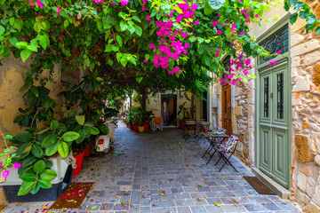 Fototapeta na wymiar Charming streets of Greek islands, Crete. Street in the old town of Chania, Crete, Greece. Beautiful street in Chania, Crete island, Greece. Summer landscape. Travel and vacation.