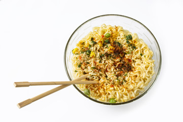 Instant noodles with spices in a plate on white background