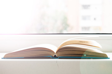 Open book on the windowsill