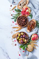 Obraz na płótnie Canvas Tu Bishvat holiday symbols - dried fruits, pomegranate, barley, wheat