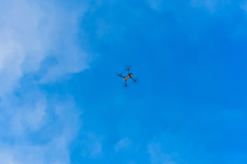 The drone flies in the winter above the forest and shoots landscape videos.