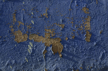 Paint is peeling off an old concrete wall. Concrete wall of an old building. The texture of the stone. Concrete wall structure.