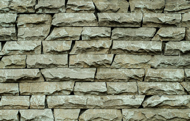 Brick wall of an old building. The structure of the stone. Brickwork. Stone wall.