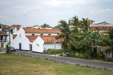 Fototapeta na wymiar Fort Galle inside, white houses with tiled roofs, road