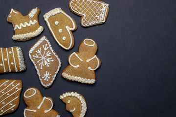 Christmas background. Handmade festive gingerbread cookies. Copy space for text. Winter holidays background mock up