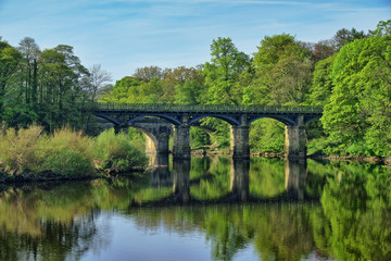 Fototapeta na wymiar A Victorian style bridge over the River Lune near lancaster.