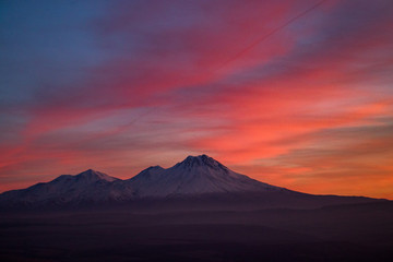 Fototapeta na wymiar Snowy Mount Hasan Volcano Anatolia Turkey Aksaray Sunset Pink Red Orange Sky