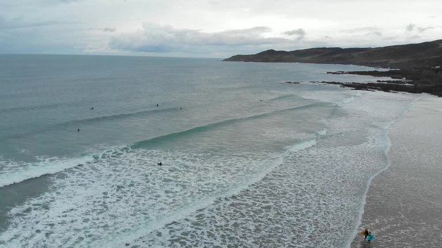 Woolacombe North Devon Winter Surf Aerial Of Rocky Coastline And Beach Surfer's And Body Boarder's