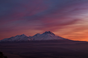 Obraz na płótnie Canvas Snowy Mount Hasan Volcano Anatolia Turkey Aksaray Sunset Pink Red Orange Sky