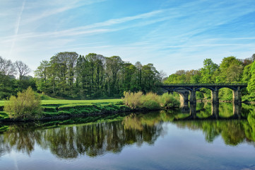 Fototapeta na wymiar A wide view of the river Lune and bridge, near Lancaster