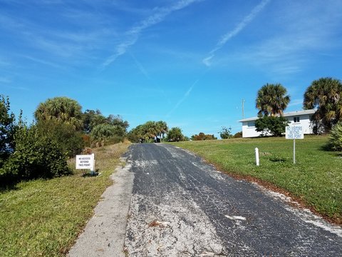 No Visitors Or Access Beyond This Point Signs And Driveway