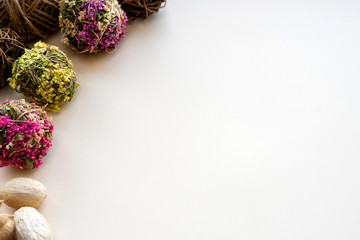 On a light craft background with burlap on the sides a herbarium of flowers and branches