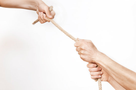 One Hand Holds The Rope And Pulls Out Of The Problems Of The Man Holding The Rope With Two Hands, The Concept Of Help And Mutual Assistance