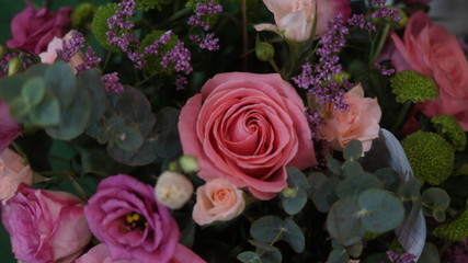 blooming garden flowers: irises, gerberas, roses, chrysanthemums