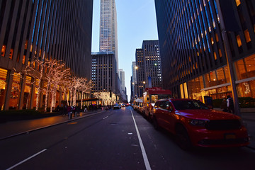 Night street view and city life on  Sixth Avenue or Avenue of the Americas, Midtown Manhattan, New York.