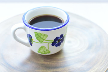  Traditional Colombian coffee cup and coffee beans on wooden background