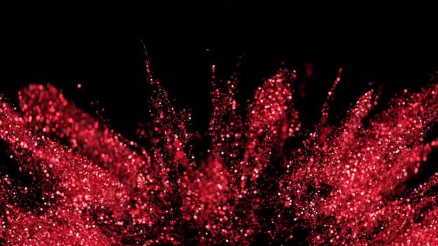 Abstract red ruby glitter explosion in slow motion. Bokeh background with shining defocus blurred sparkles. Dust macro close up backdrop with logo copy space and alpha channel. 4k ProRes422